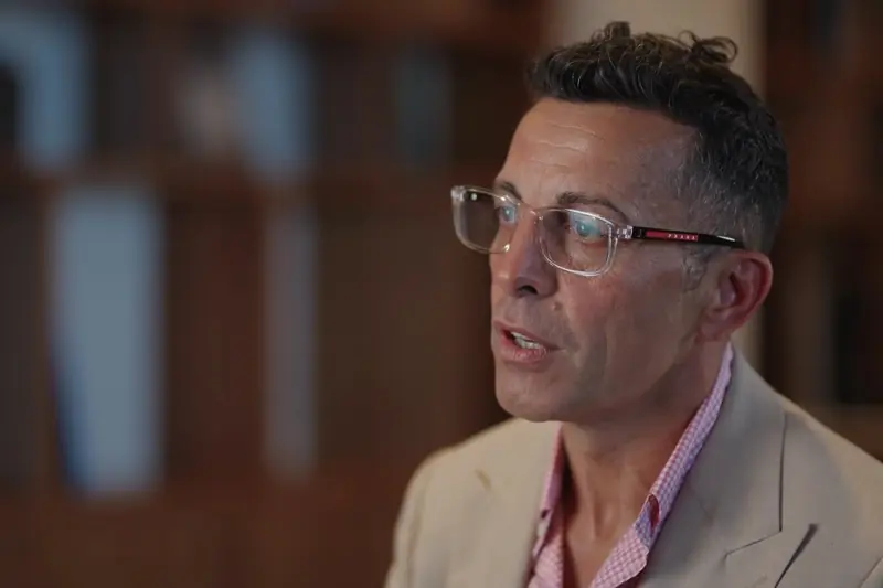 Corporate Video Production in Mexico: executive interview lit in a library for a corporate video
