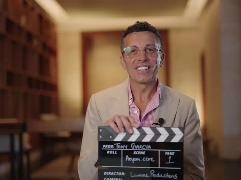 Interviewee holding a clapperboard before recording