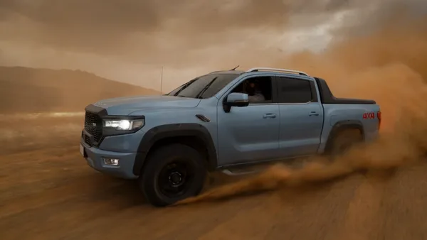 Pickup truck drifting through desert dust during a commercial shoot in Mexico